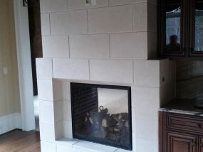 modern fireplace in stone tiles